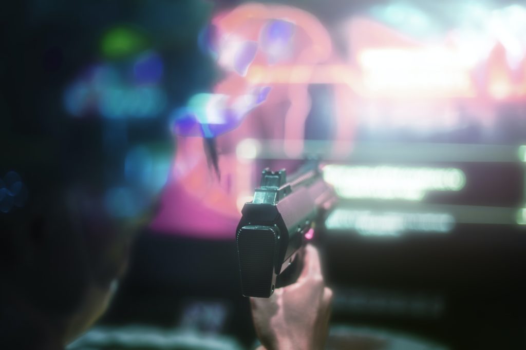 Man playing game in the arcade digital entertainment technology